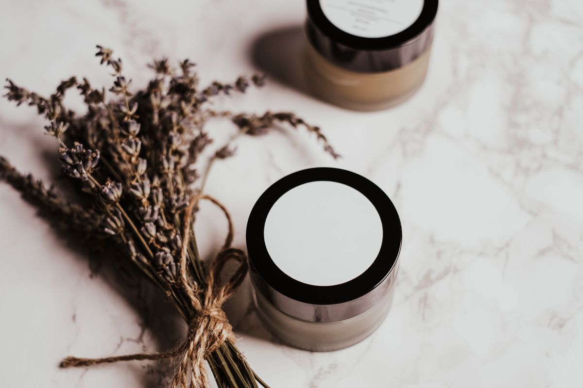 A white cosmetic product container on a table